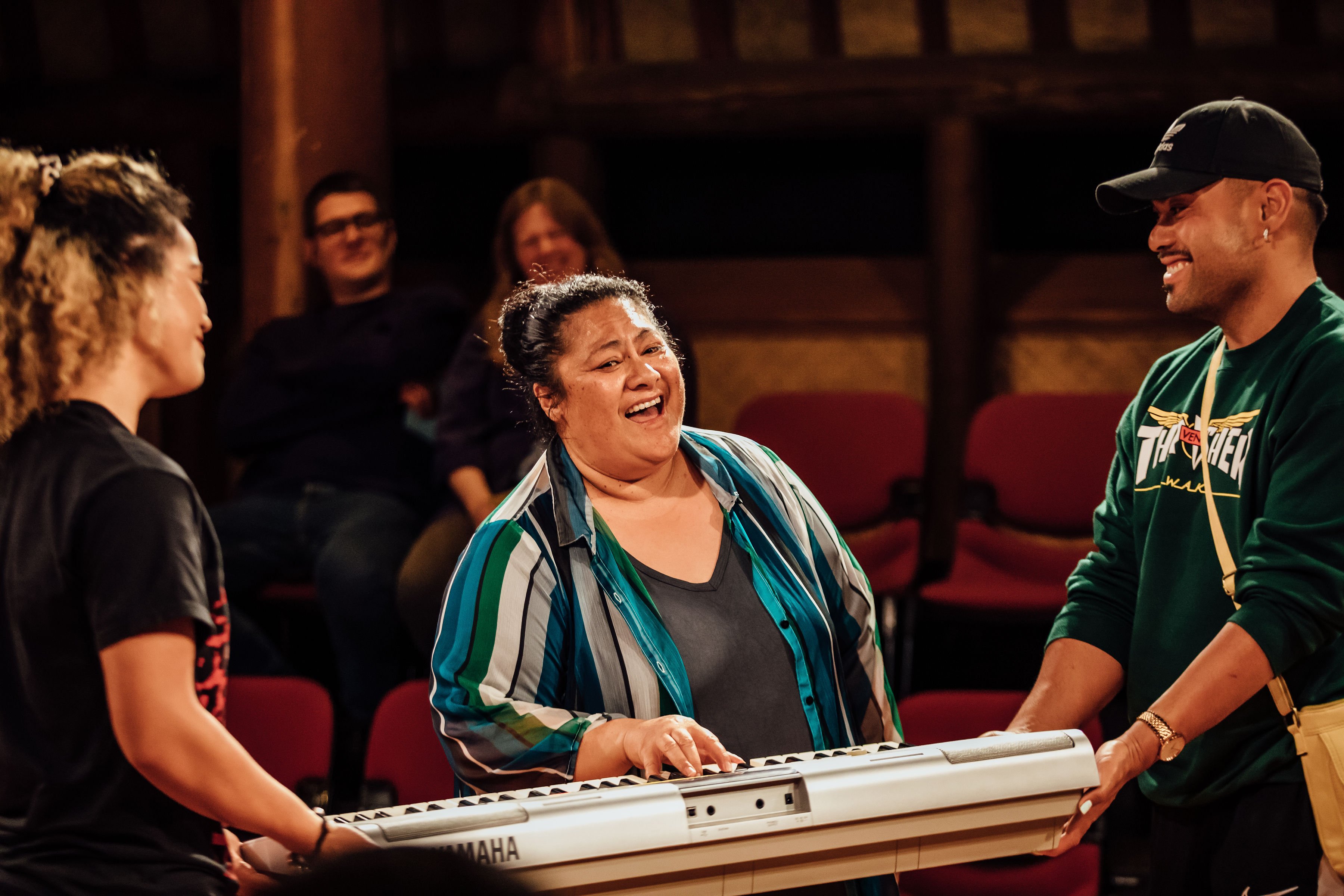 Anapela Polata'ivao performs Every Brilliant Thing with help from two audience members.